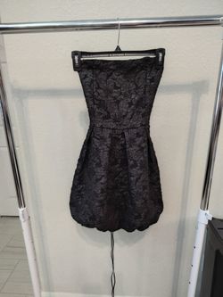 black strapless mini dress with  textured, embossed floral pattern and a structured, puffball skirt design. women,  size XS