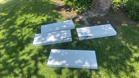 4 white wall shelves