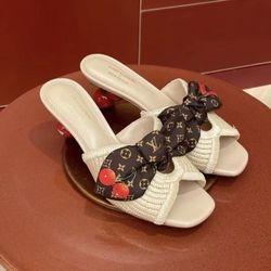 Designer high-heeled slippers
