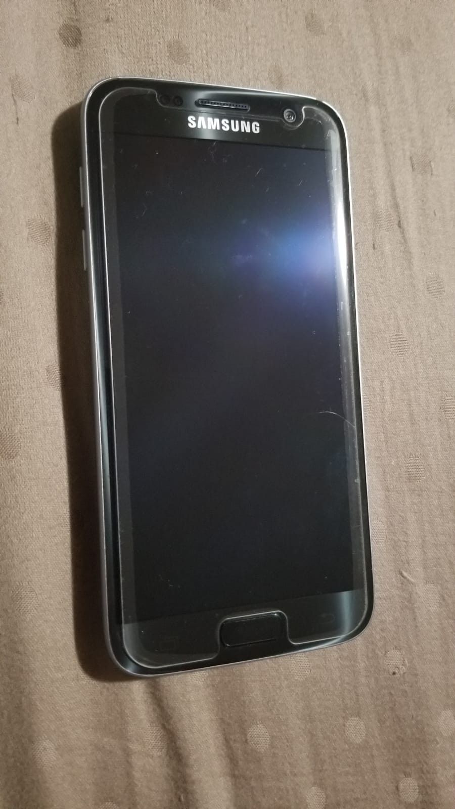 Samsung galaxy s7 factory unlocked with charger $200 obo or trade for an iphone s6 unlocked or from metro pcs or T-mobile