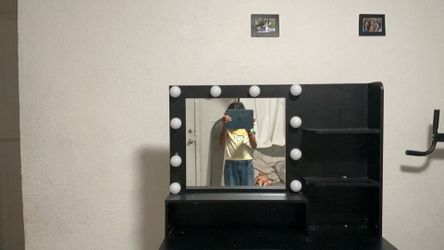 Black vanity has a few spots on. It comes with a chair. What if I sold my squishy? Black vanity has a few spots on and the lights don’t work