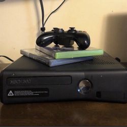 xbox 360 with games and controllers