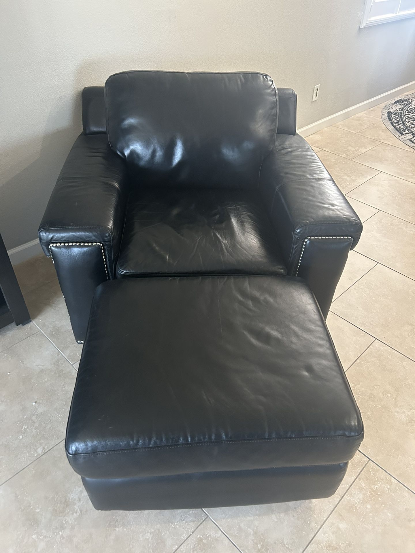 Black Leather Chair and Ottoman