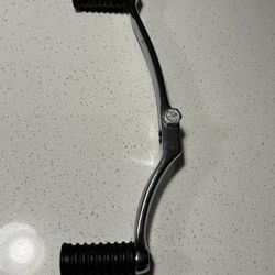 Brand New OEM Harley Davidson brand chrome Heel and Toe shifter lever with 2 Harley Davidson stamped rubber pads