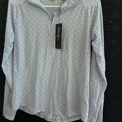 This is a Walter Hagen Women's P11 UV Protection 1/4 Zip Pullover in the color known as "Geo Crisp Peri" or a light purple/lilac shade. Size S Brand N
