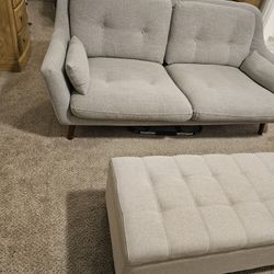 New Small Lite Grey Sofa with Ottoman.  Nice for A Room That Need Plenty Space With Comfort Small Settings.