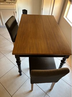 Table and 2 cushioned chairs