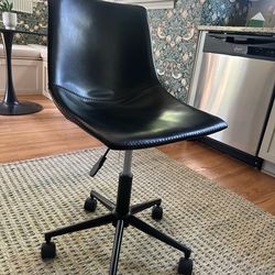 Black faux-leather office chair