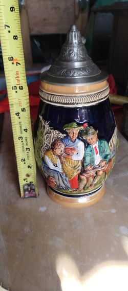 vintage German beer stein with a pewter lid