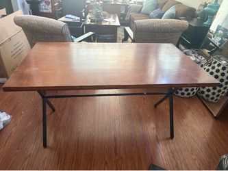 Solid wood converts from dining table to coffee table. Great condition