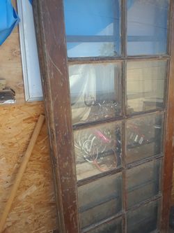 Two old patio doors size 36inch wide 79.1/2 inch tall 10 panel glass door $80.00