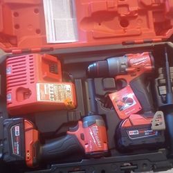 Milwaukee M18 Fuel impacts with new battery and charger in their box 