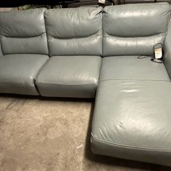 Baby blue leather powered recliner with manual arm chair