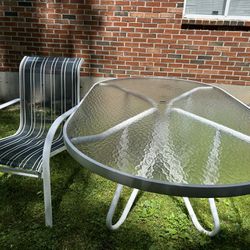 Patio Table 74inch By 42.5  With 6 Chairs  and Blue Umbrella  