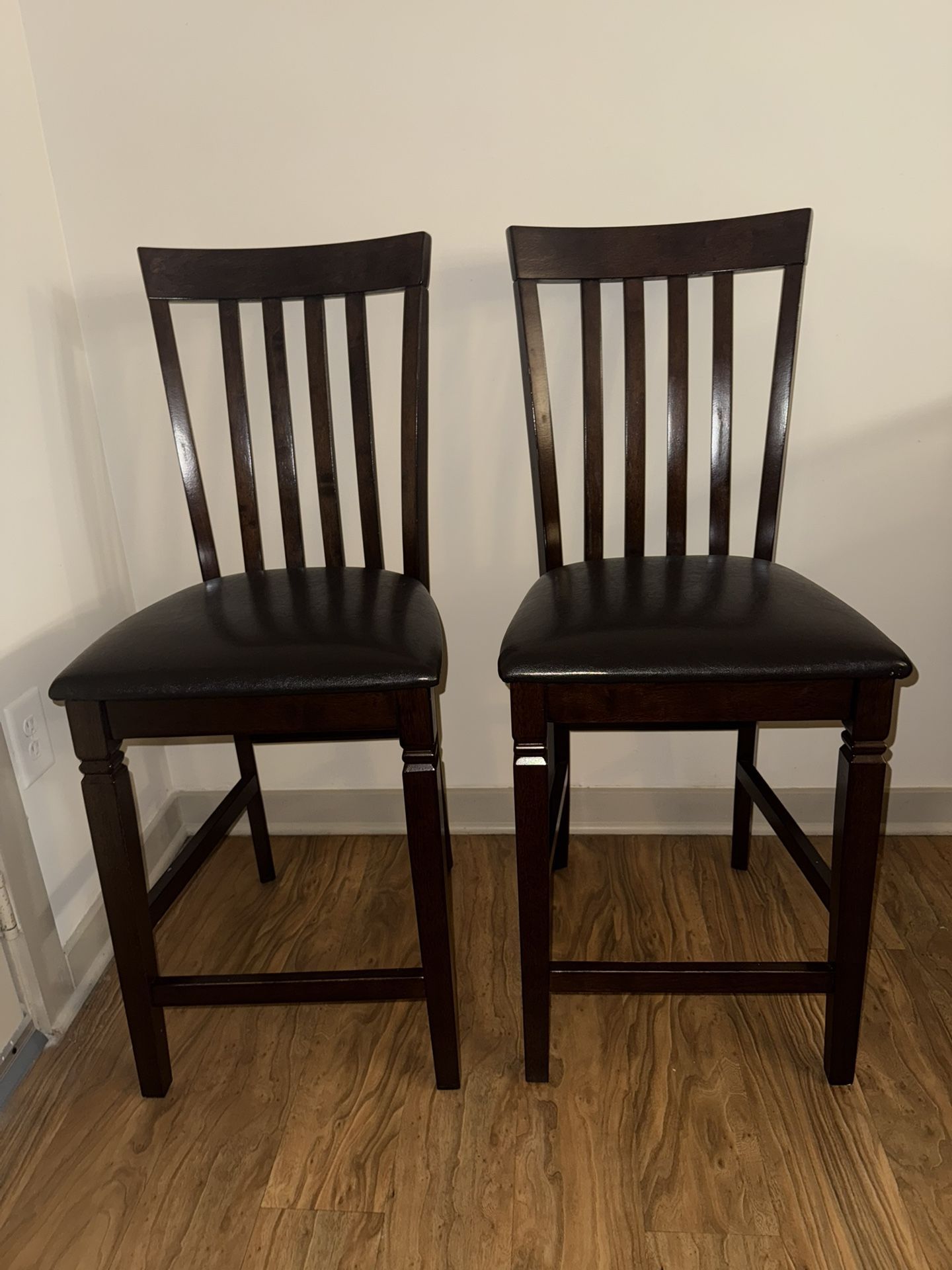 4 Pub Style tall dinning chair Seats Dark Wood Leather PU Cushioned. Will sell separately.