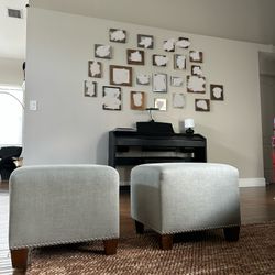 2 Gray Ottomans With Wooden Legs