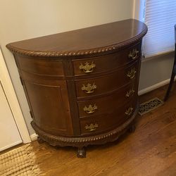 A traditional mahogany  "demilune" or half round hall or linen chest or dresser