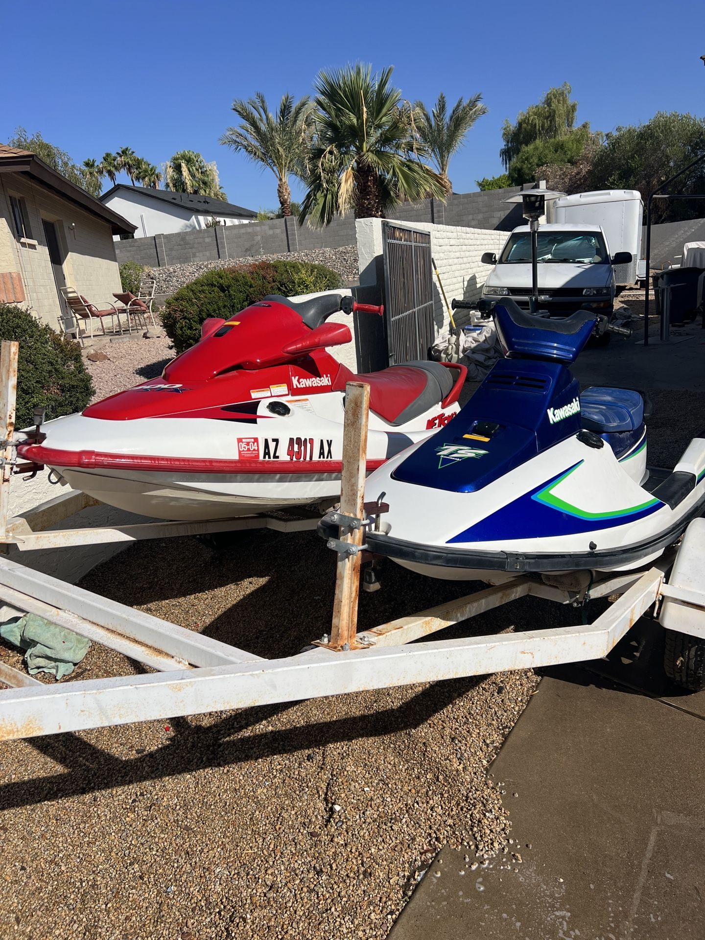 Two Kawasaki Jet Skis With Trailer And Dolly