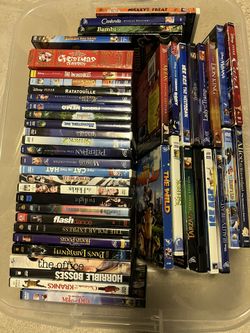 Assortment Of DVDs And Portable DVD Player