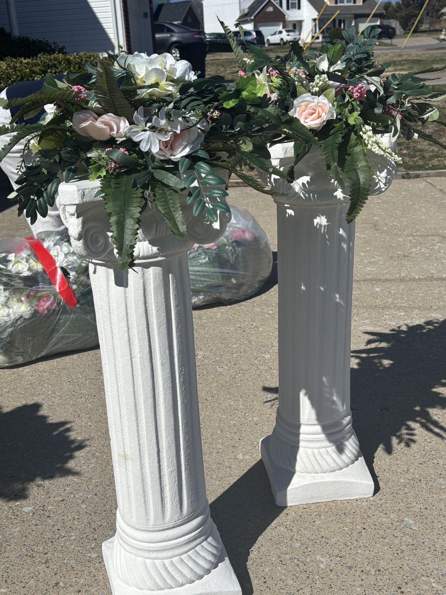 Roman bases with floral arrangements