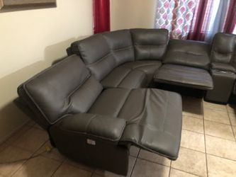 Gray Leather Sectional Sofa with Recliner.