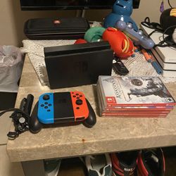 Nintendo Switch-All Cords, red And Blue Switch’s With Black Cord, 8 Games