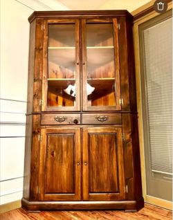 Two separate priced corner cabinets read the description
