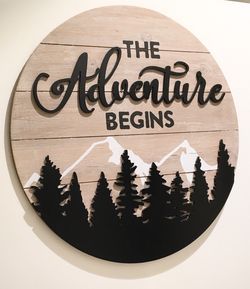 “Adventure Begins” wooden wall decor, 22”x22”