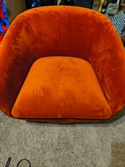 Orange swivel accent chair by Jason Furniture