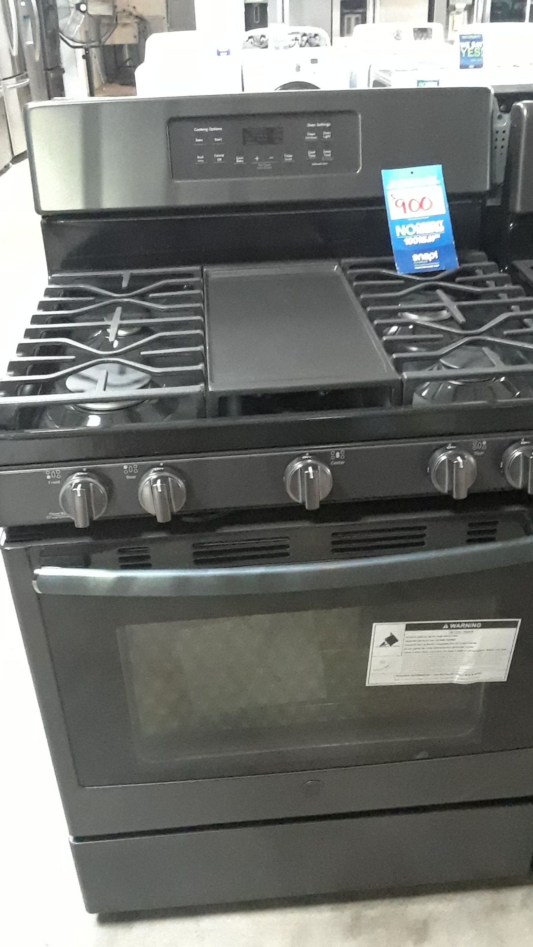 ESTUFA DE GAS COLOR NEGRO MARCA GENERAL ELECTRIC 4 QUEMADORES COMAL Y HORNO