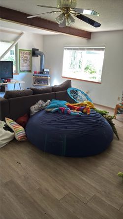 $300 giant bean bag- Microfiber dark blue. Super cozy. Moving big to take with . Washable cover.