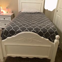 white twin frame and mattress