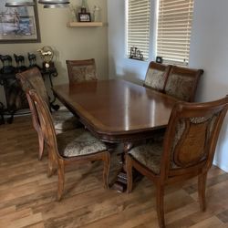 Beautiful Dining Table And 10 Chairs, Two Of Which Are Captains  Chairs 