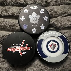 3 Various NHL Hockey Pucks