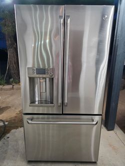 GE Cafe counter depth French doors stainless steel refrigerator with water and ice dispenser