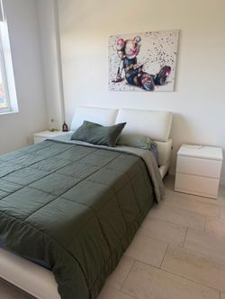 Bed with mattress and nightstand