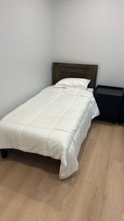 Single bed with mattress and nightstand