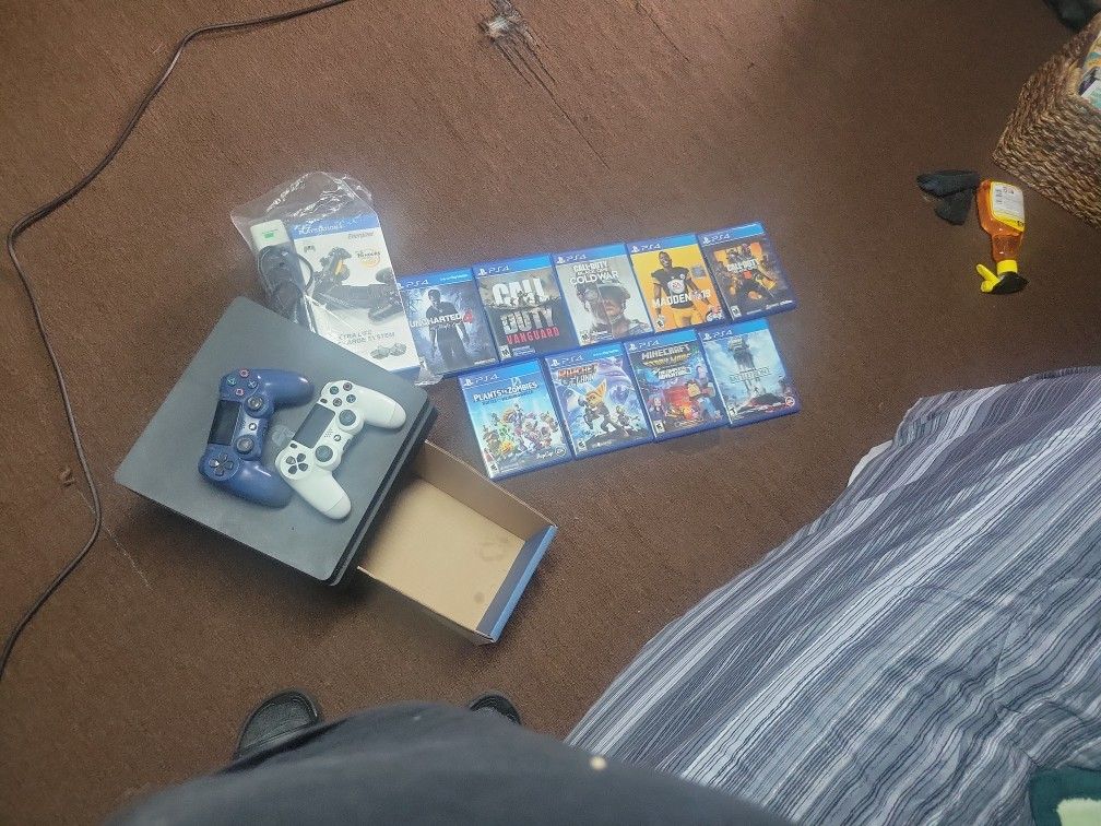 Ps4 Slim Good Condition With 9 Games, 2 Controllers Charge Port That Charges Up To Two Controllers
