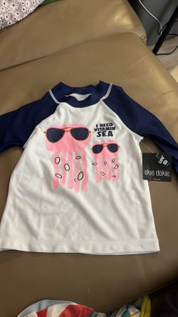 Okey-dokey I need vitamin sea swim shirt. UPF 50 swim top new with tag no bottoms just the shirt. Okey-dokey I need vitamin C. UPF 50 swim top new wit