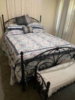 Queen size black rot iron bed with matching bench