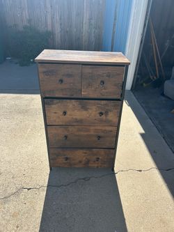 Brown IKEA mini dresser with 5 drawers