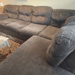 Full Sized Couch with Chaise!  Solid used condition.   Needs to be out by July 1st