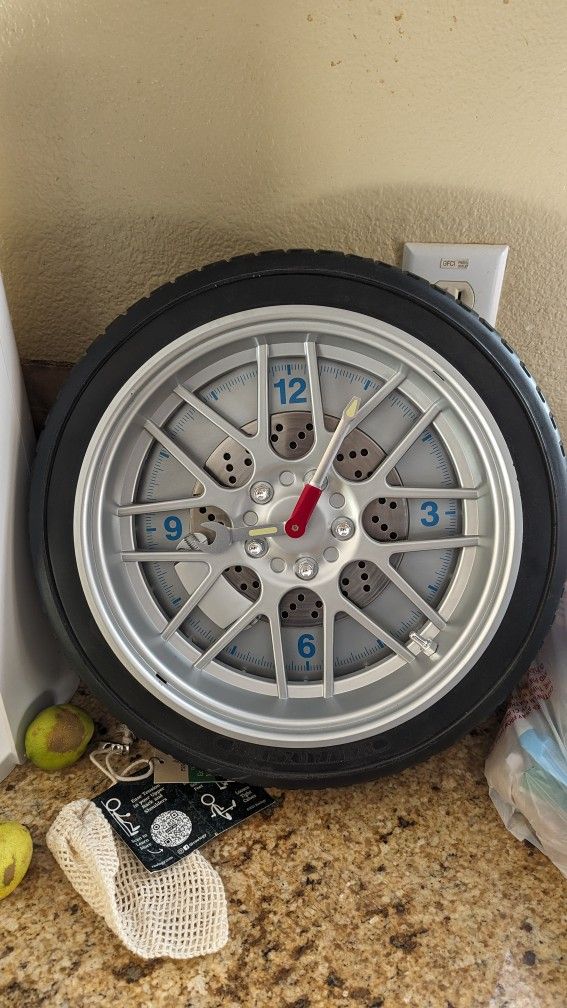 Clock. Beautiful Wall Clock, Like A Tyre. For Car Enthusiastic