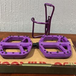 Purple One up bike pedals and aluminum Specialized bottle holder 