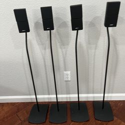 4 Bose Cube Speakers on Stands