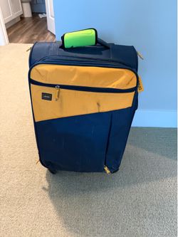 Lucas softside spinner suitcase features a distinctive blue and yellow design 20 inches