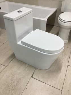 One piece toilet new in the box elongated dual flush system with fully skirted tornado flush system ready for pick up today