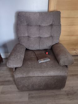 Brand new Mcombo power lift recliner. Retail $800