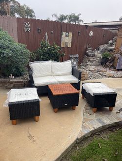 Costway 4 PCS Patio Furniture Set with Storage Table Ottomans Soft Pillows & Cushions