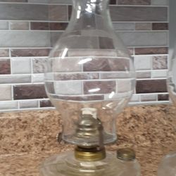 OIL LAMPS ONE LOOKS TO BE FROM THE 60S READ BELOW 